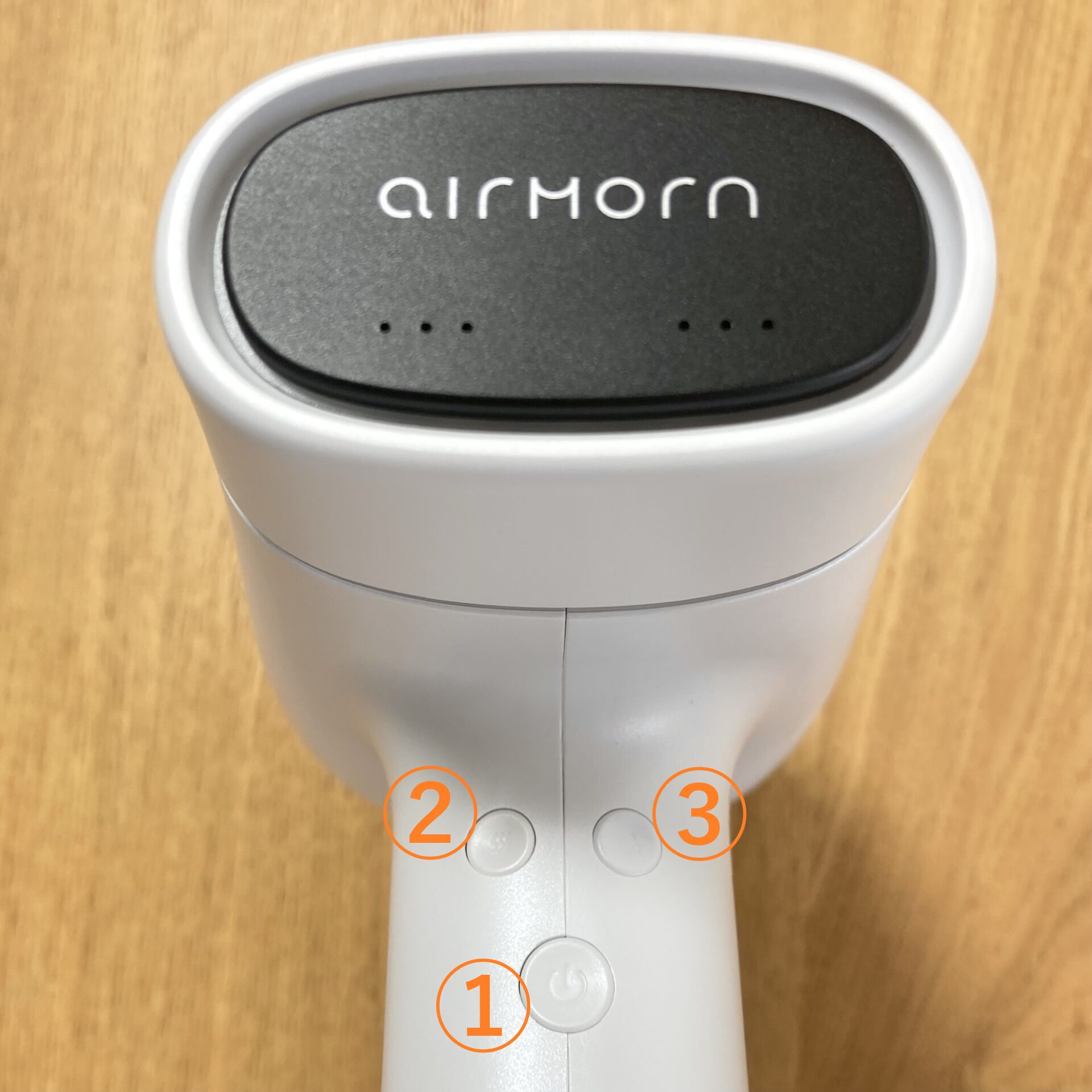 airmornの持ち手にあるボタンの写真